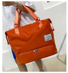 Large capacity travel duffel bag orange gym sports bag with wet dry compartment.
