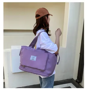 Grand sac de voyage imperméable pour femme, grand sac de rangement pliable et léger.