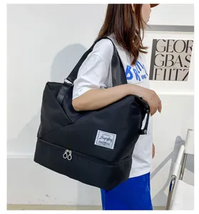 Large capacity travel duffel bag for women, waterproof gym bag with bottom compartment for trips.
