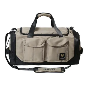 Detailed view of the large capacity travel duffel bag featuring dual front pockets and shoulder strap.