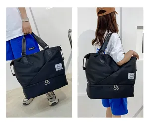 Detail view showing large capacity travel duffel bag with bottom shoe compartment.