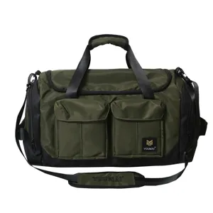 Large capacity green travel duffel bag with front pockets and adjustable shoulder strap.