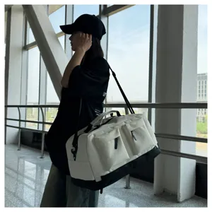 Large capacity travel duffel bag multi pocket gym sports luggage storage bag detail view.