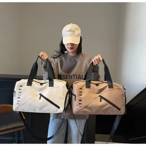 Detail view of large capacity waterproof travel gym bag with dry wet separation in white and khaki.
