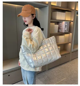 Silver quilted puffer tote bag for women, stylish lightweight shoulder bag for daily use.