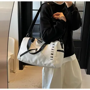 Large capacity travel gym bag with waterproof design, white and black sporty duffel style.