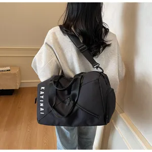 Large capacity waterproof travel duffel bag for women and men fitness sports gym use.