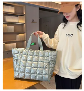 Quilted metallic tote bag for women, stylish lightweight shoulder bag for casual and travel use.