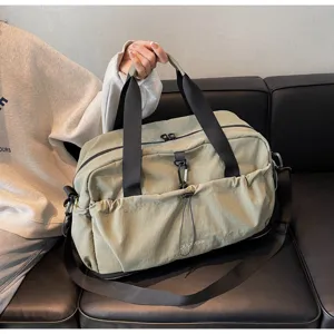 Large capacity travel duffel bag detail showcasing waterproof fabric and convenient front pocket design.
