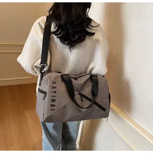 Large capacity waterproof travel duffel bag detail, carrying view for gym and sports use.