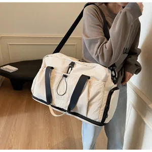 Large capacity travel duffel bag for women, lightweight waterproof gym bag with shoe compartment.
