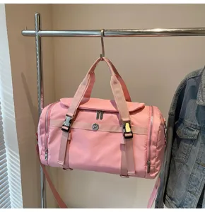 Pink travel gym bag with large capacity, dry wet separation, and durable dual handles.