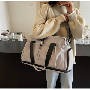 Lightweight expandable travel duffel bag for women, large capacity waterproof gym luggage bag.