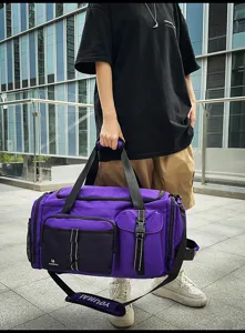 Detailed view of the large capacity purple travel duffel bag with multi pockets and straps.