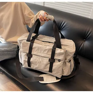 Grote capaciteit reistas schoudertas crossbody tas voor heren en vrouwen lichtgrijs.