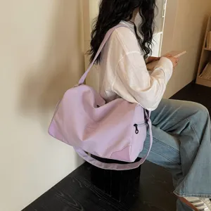 Women large capacity gym duffel bag, waterproof travel shoulder bag for sports and fitness.