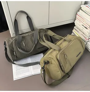 Closeup detail of large capacity casual travel duffel bag, gym sport bag with front pocket.