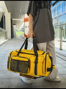 Yellow travel duffel bag scene detail, large capacity sports gym bag with pockets.