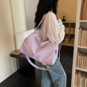 Large capacity purple duffel bag for women, ideal for gym, fitness, and travel trips.