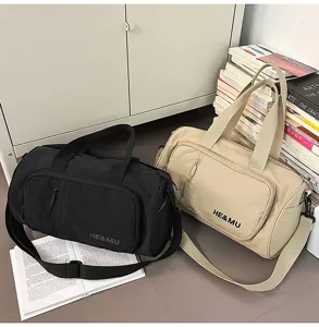 Detail view of lightweight large capacity travel duffel bag with shoulder strap for women.