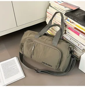 Detailed view of the large capacity travel duffel bag, casual gym bag with sturdy handles.