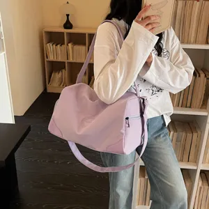 Lightweight purple travel duffel bag with large capacity, ideal for gym, sports and daily use.