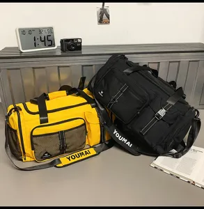 Detail view of large capacity waterproof travel duffel bag, casual sports backpack with multiple pockets.