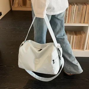Detail view of light blue travel duffel bag for fitness and short trips with large capacity.