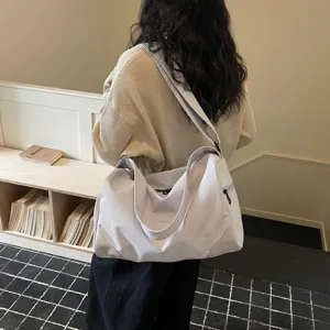 Spacious travel duffel bag for gym and weekend trips, lightweight and stylish design.