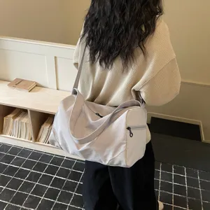 Large capacity gym duffle bag for women, lightweight travel luggage and sports fitness carrier.