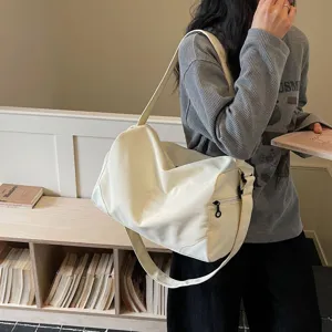 Large capacity white sports duffel bag for women, lightweight travel luggage and fitness bag.