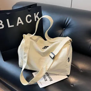 Large capacity sports gym duffel bag for women, casual travel weekender bag with shoulder strap.