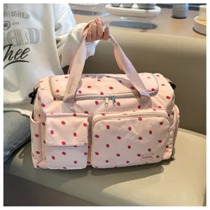Pink corduroy travel bag with cute strawberry pattern, large capacity, multi-pocket design.