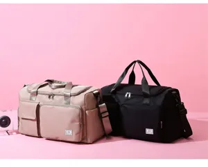Detailed view of large capacity travel duffel bag with multi-pocket design and durable fabric.