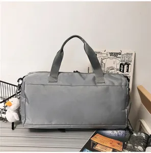 Gray multifunctional travel duffel bag, large capacity sports fitness bag for men and women.