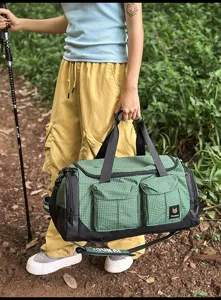 Outdoor multifunctional travel duffel bag with large capacity, dry wet separation and green grid.