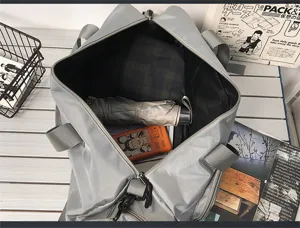 Large capacity waterproof travel duffel bag, casual grey sports fitness gym bag for men and women.