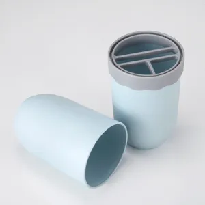 Portable travel toothbrush cup storage box with compartment lid, ideal for business trips.