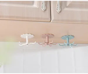 Plastic rotating multi-claw hook detail, punch-free kitchen storage rack under cabinet.