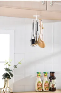 White plastic rotating kitchen hook, punch-free under cabinet hanging rack for utensils storage.
