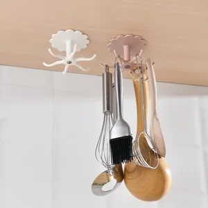 Punch-free rotating kitchen hook adhesive wall-mounted storage rack utensil organizer.