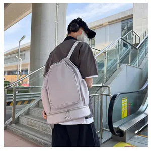 Detail shot of the large grey drawstring sports backpack, ideal for fitness and commute.