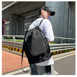 Detail view of large capacity black drawstring sports backpack for basketball fitness and gym use.