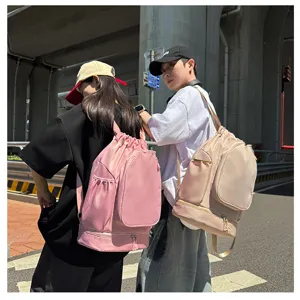 Large capacity drawstring backpack with front zipper pocket and side slots for sports and fitness.