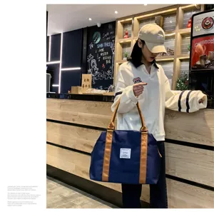 Grand sac de voyage avec poignées marron, fourre-tout de rangement léger pour un usage quotidien.