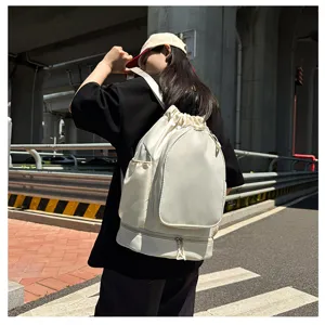 White drawstring sports backpack, large capacity gym bag for basketball, pickleball or fitness use.