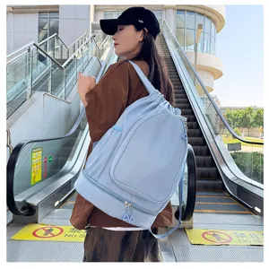 Large capacity light blue drawstring sports backpack with bottom compartment, detail view.