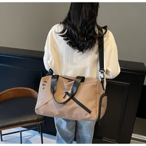 Detailed view of large capacity waterproof travel duffel bag with shoulder strap and wet pocket.