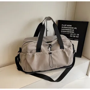 Large capacity travel duffel bag lightweight waterproof gym sports shoulder bag for women.