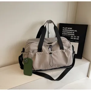 Large capacity travel duffle bag waterproof sports gym bag detail view showing front pocket